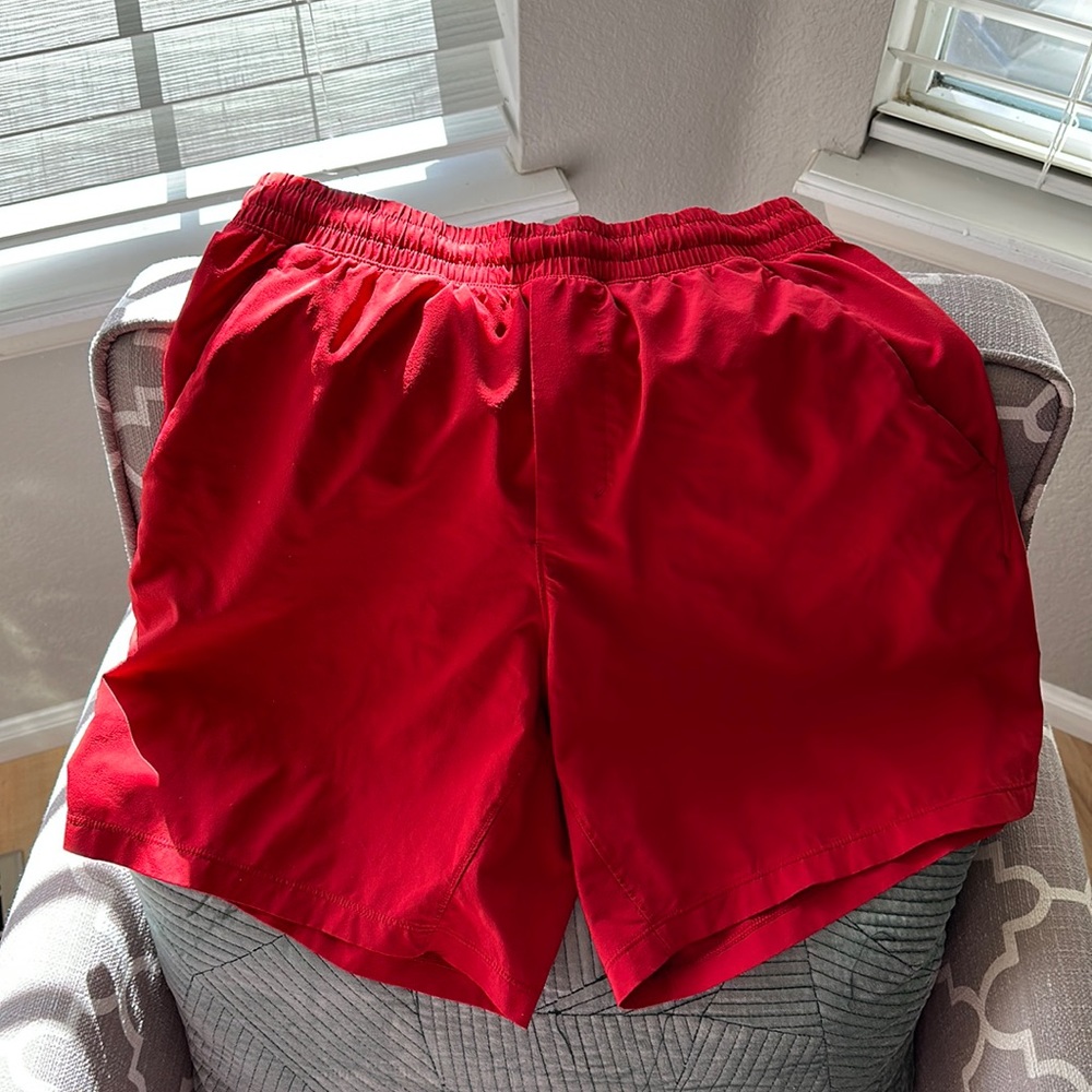 Lululemon Pace Breaker linerless short 7” size small in red